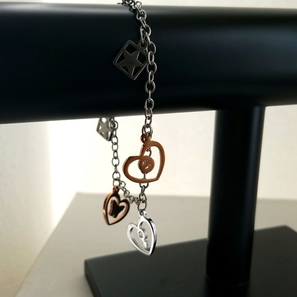 Bracelet with charms. Two tone in stainless Steel.